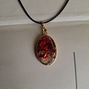 Gold Oval Red Glitter Pendant Necklace with Black Cord